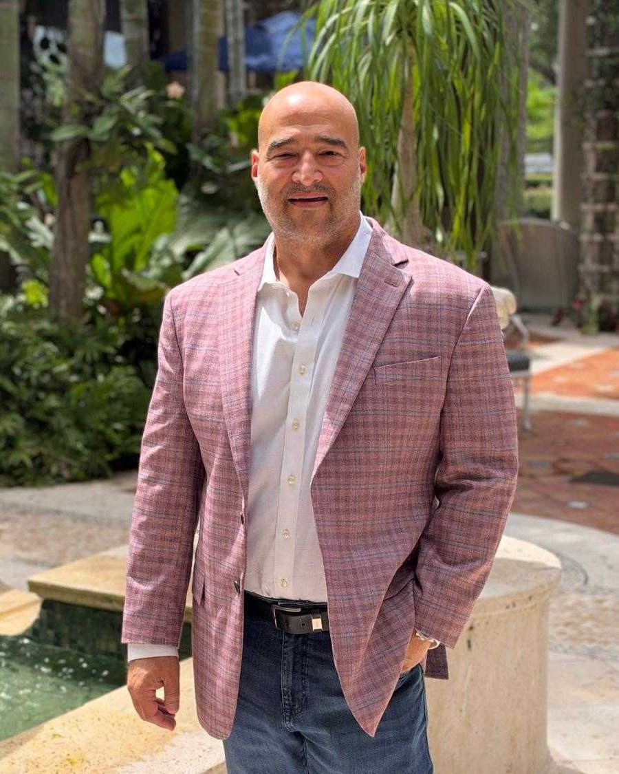 Mayer Dallal, founder of Private Client Lending, in a garden courtyard.